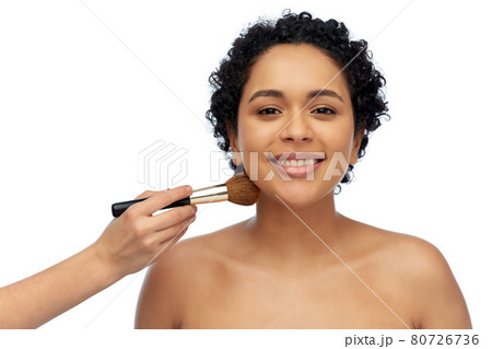 happy woman and hand of make up artist with brush happy woman and hand of make up artist with brush 80726736