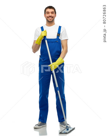 male cleaner in overall cleaning floor with mop 80726863