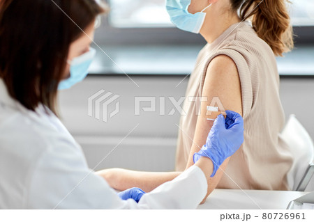 close up of doctor attaching patch to patient close up of doctor attaching patch to patient 80726961