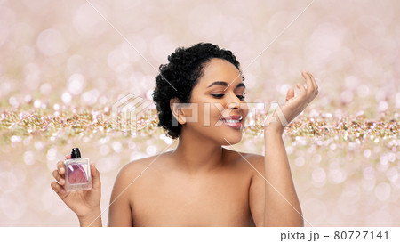 young african american woman with perfume 80727141