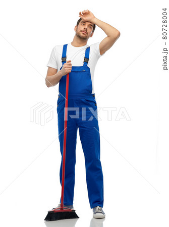 tired male cleaner cleaning floor with broom tired male cleaner cleaning floor with broom 80728004