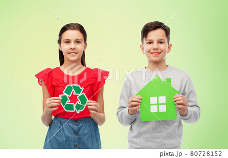 smiling little girl and boy holding green houses 80728152
