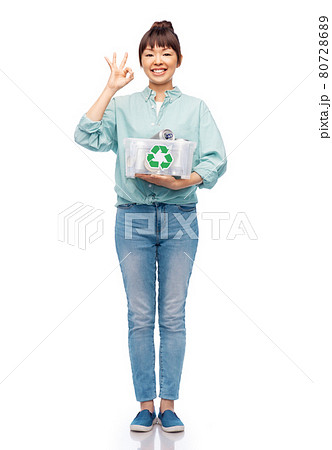 smiling young asian woman sorting metallic waste 80728689
