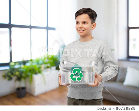 smiling boy sorting metallic waste 80728839