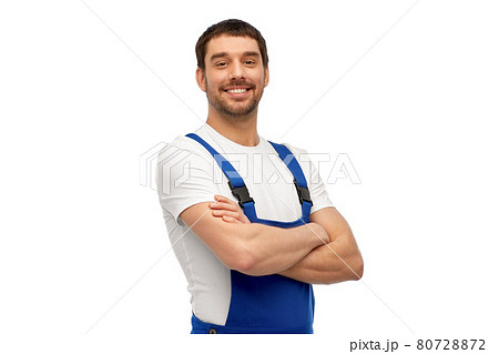 happy smiling male worker or builder in overall happy smiling male worker or builder in overall 80728872