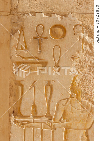 Ancient egyptian paintings and hieroglyphs on a wall in Mortuary temple of Hatshepsut in Luxor, Egypt Ancient egyptian paintings and hieroglyphs on a wall in Mortuary temple of Hatshepsut in Luxor, Egypt 80729830