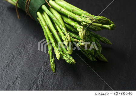 Asparagus from the garden on black stone background 80730640