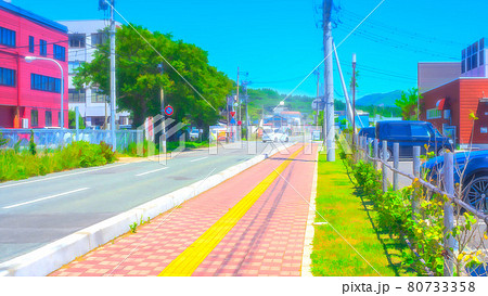 道路と町並み アニメ風加工のイラスト素材