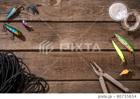 Accessories for fishing on the background of wood. Top view 80735654