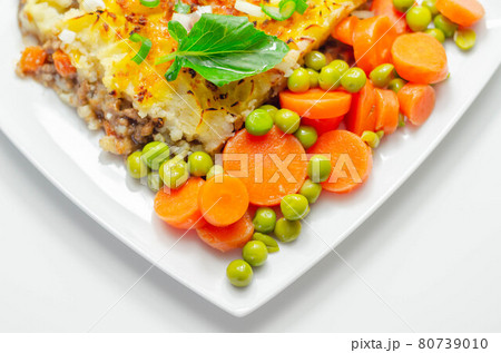 Shepherd's pie, tender minced lamb with garden veg in a hearty gravy beneath butter mash with carrots and green peas Shepherd's pie, tender minced lamb with garden veg in a hearty gravy beneath butter mash with carrots and green peas 80739010