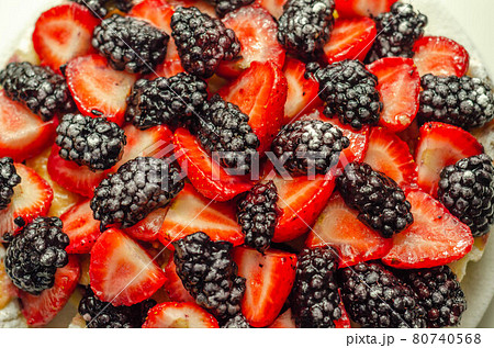 Butter enriched shortcrust pastry topped strawberries and blackberries, seasonal cake with colorful decoration Butter enriched shortcrust pastry topped strawberries and blackberries, seasonal cake with colorful decoration 80740568