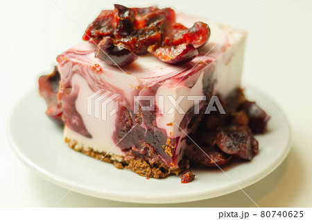 Japanese cheesecake with cherry sauce and fresh cherries on the ceramic plate and red background Japanese cheesecake with cherry sauce and fresh cherries on the ceramic plate and red background 80740625