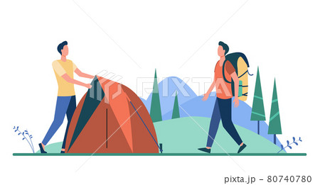 Two tourists pitching tent on meadow 80740780