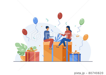 Tiny people sitting on gift box 80740820