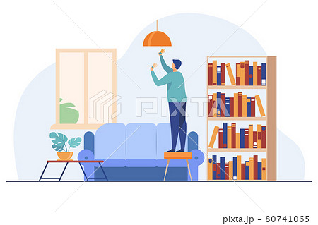 Man inserting light bulbs into chandelier 80741065