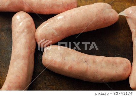 Raw classic British sausage made from prime cuts of pork on the wooden board 80741174