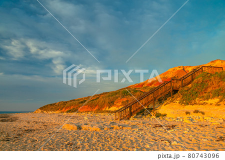 Boardwalk to Port Noarlunga South beach at sunset 80743096