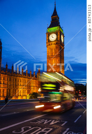 London cityscape with Elizabeth Tower or Big Ben and Doubledecker bus moves along the Westminster Bridge London cityscape with Elizabeth Tower or Big Ben and Doubledecker bus moves along the Westminster Bridge 80743313