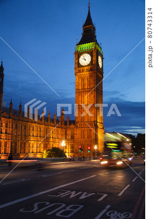London cityscape with Elizabeth Tower or Big Ben and Doubledecker bus moves along the Westminster Bridge London cityscape with Elizabeth Tower or Big Ben and Doubledecker bus moves along the Westminster Bridge 80743314