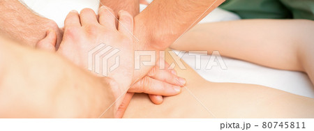 Woman receiving a back massage Woman receiving a back massage 80745811