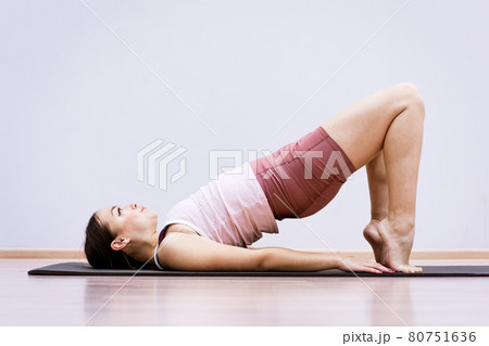 Woman doing fitness at home against wall background 80751636