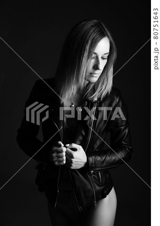 Portrait of a woman in a leather jacket and lingerie, black and white photo Portrait of a woman in a leather jacket and lingerie, black and white photo 80751643
