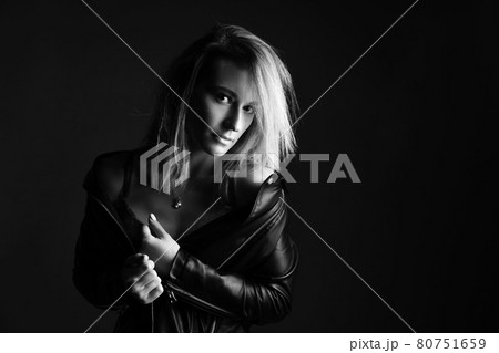 Portrait of a woman in a leather jacket and lingerie, black and white photo Portrait of a woman in a leather jacket and lingerie, black and white photo 80751659