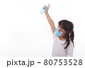 Cute Asian girl wearing a mask and washing her hands with alcohol to prevent spreading the disease on a white background. Prevention of the spread of influenza virus Coronary COVID-19 influenza 80753528