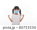 asia girl wearing mask to protect against Coronavirus, girl show a fist encourage to fight contagious disease concept stop virus Covid 19 outbreak to win on white background 80753530