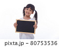 little Asian child show the black board on isolated background 80753536