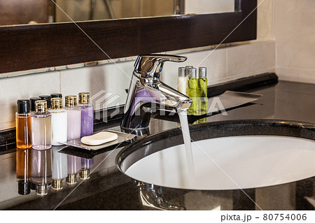 Mini bottles of cosmetics on the table in the hotel 80754006