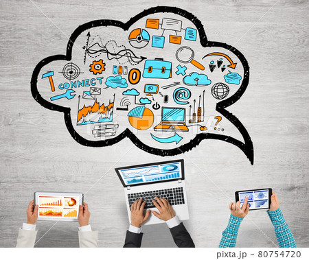 Top view of businesspeople sitting at table and using gadgets Top view of businesspeople sitting at table and using gadgets 80754720