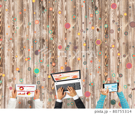 Top view of businesspeople sitting at table and using gadgets 80755314