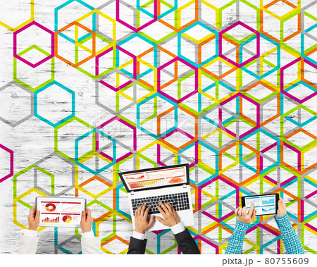 Top view of businesspeople sitting at table and using gadgets 80755609