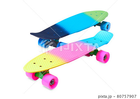 Two rainbow plastic Penny board skateboards on white background 80757907