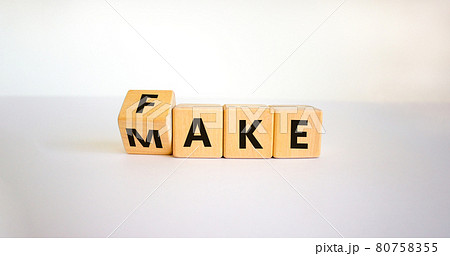 Fake it until you make it symbol. Turned a cube and changed the word 'fake' to 'make'. Beautiful white background. Business, and fake it till you make it concept. Copy space. Fake it until you make it symbol. Turned a cube and changed the word 'fake' to 'make'. Beautiful white background. Business, and fake it till you make it concept. Copy space. 80758355