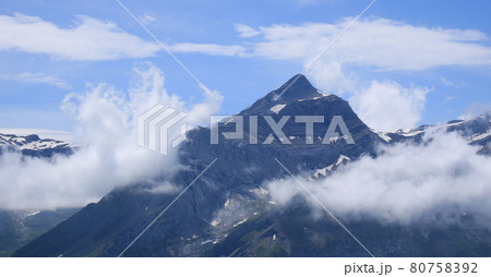 Peak of Mount Oldehore surrounded by clouds. 80758392