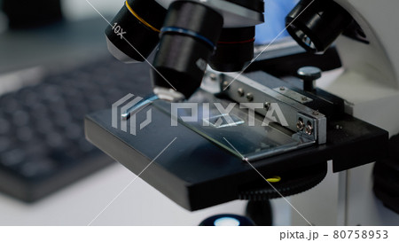Close up of microscopic sample tray for optical analysis Close up of microscopic sample tray for optical analysis 80758953