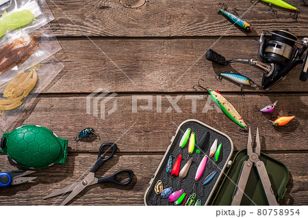 Accessories for fishing on the background of wood. Top view 80758954