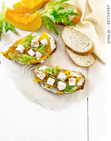 Bruschetta with pumpkin and ricotta on board top Bruschetta with pumpkin and ricotta on board top 80759587