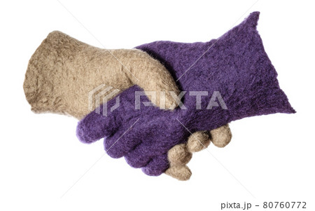 handshake of purple and green woolen gloves 80760772