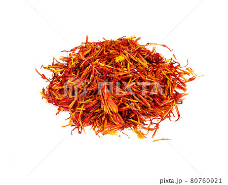 pile of dried safflower petals closeup on white 80760921