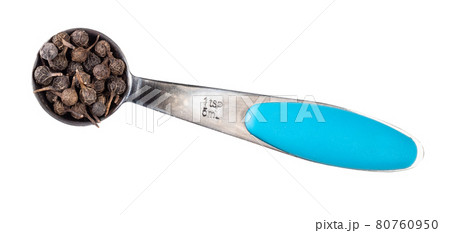 dried cubeb pepper in measuring teaspoon cutout dried cubeb pepper in measuring teaspoon cutout 80760950