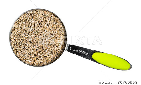 scagliola canary seeds in measuring cup cutout scagliola canary seeds in measuring cup cutout 80760968