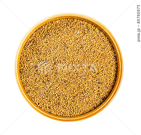 yellow seeds of White Mustard in bowl cutout 80760975