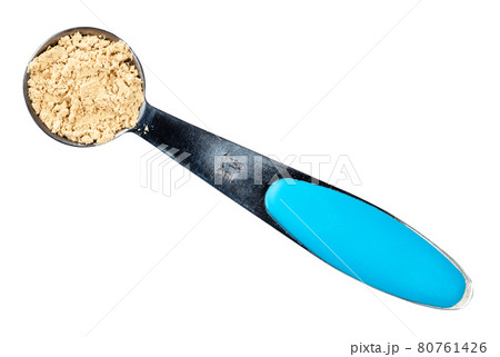 ginger powder in measuring teaspoon cutout ginger powder in measuring teaspoon cutout 80761426