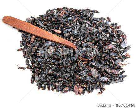 wood spoon on pile of Berberis fruits on white 80761469