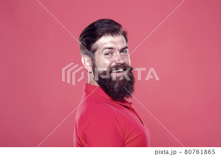 His long beard works well. Happy hipster red background. 80761865