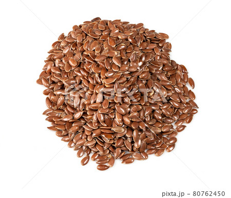 handful of brown flax seeds closeup on white handful of brown flax seeds closeup on white 80762450