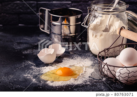 Table with baking products and tools. Table with baking products and tools. 80763071